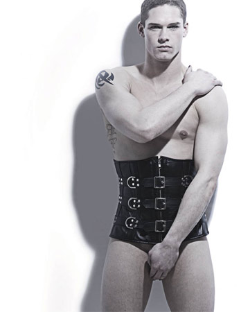 Brett Reeves in a corset, photo by Queerty
