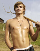 Swiss hunk guy shirtless with pitchfork